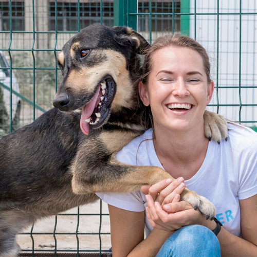 Smiling girl with a dog